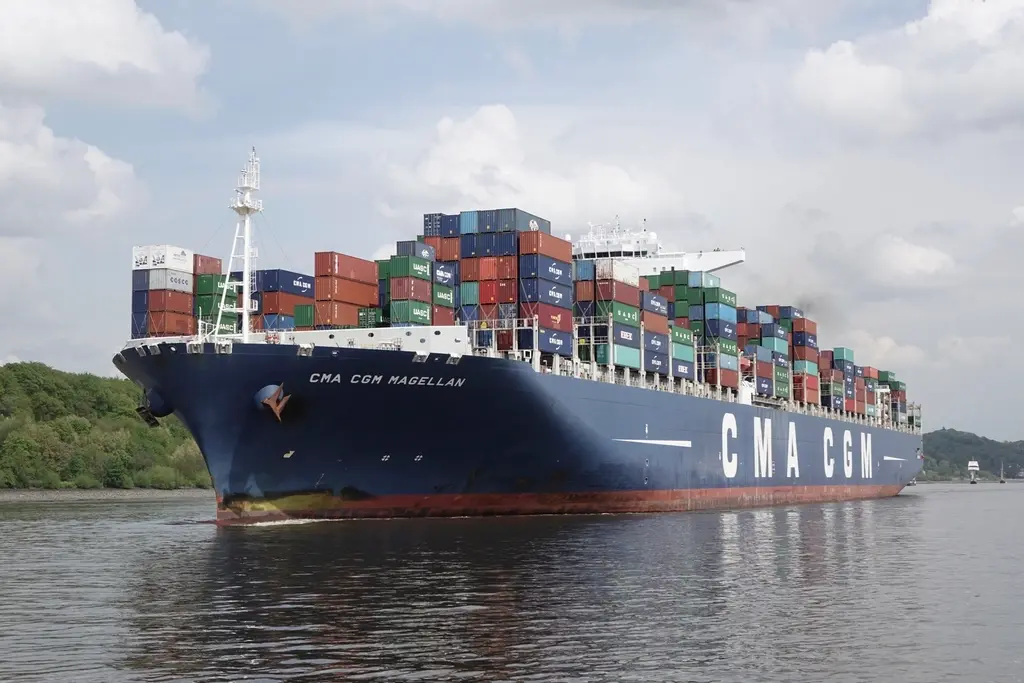 Container ship docked at a busy commercial port