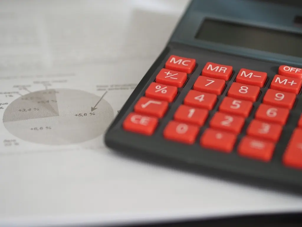 Calculator and financial documents used for payroll processing