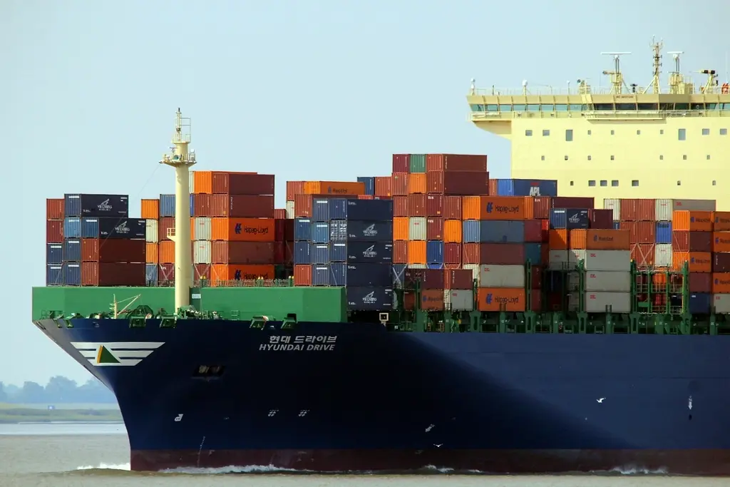 Cargo ship carrying shipping containers, representing supply chain logistics
