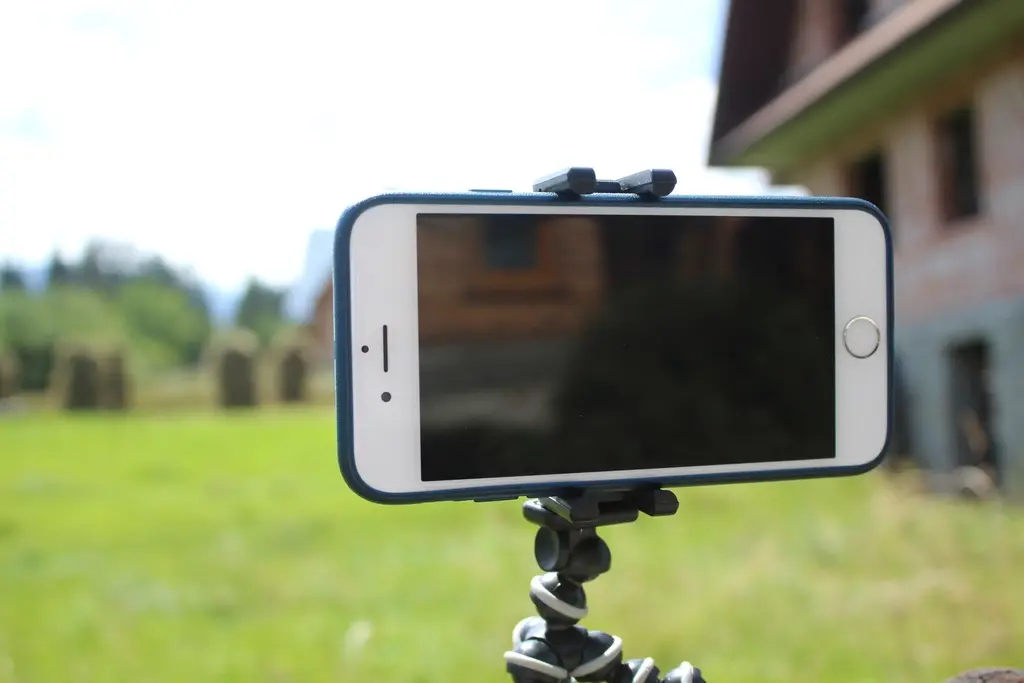 Smartphone mounted on a tripod recording video, representing short-form video content production in Dubai