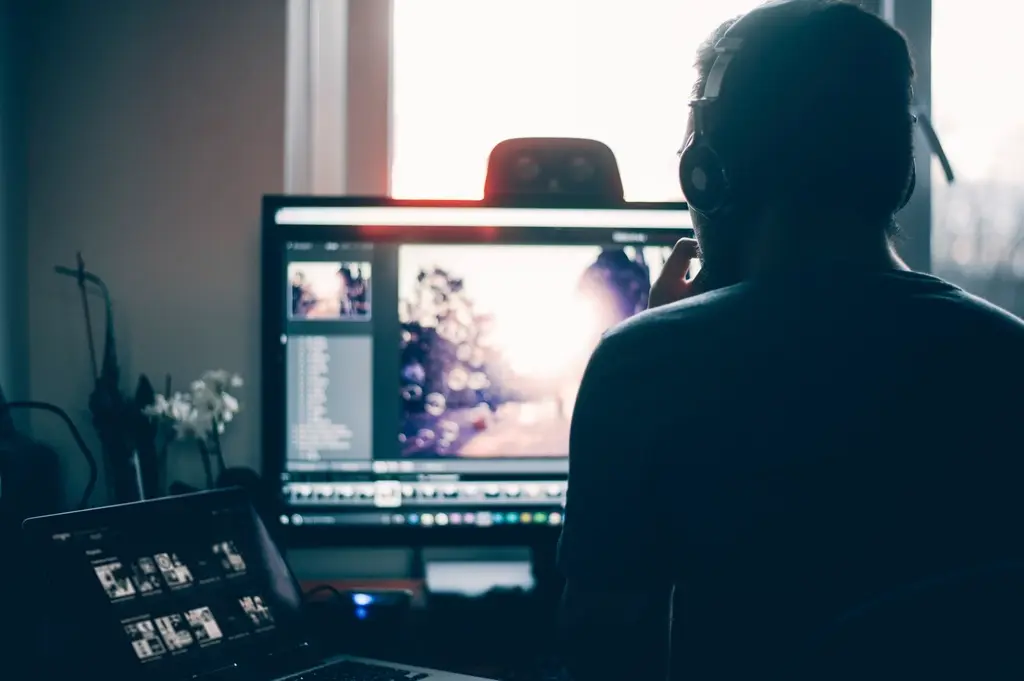 Designer working on brand concepts at a computer workstation