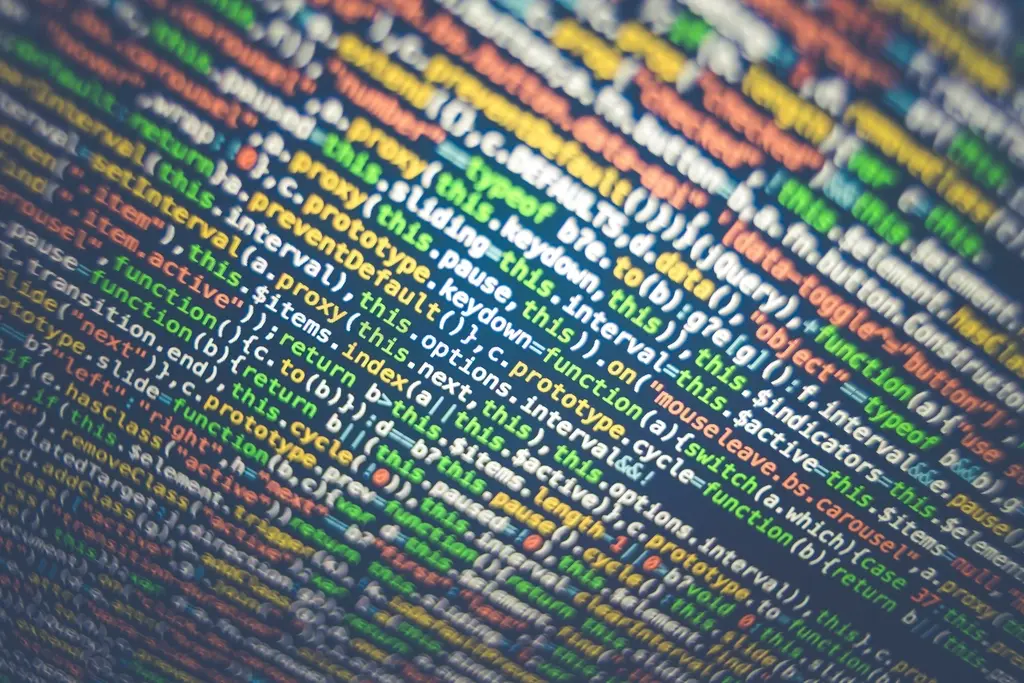 Close-up of colorful code displayed on a computer monitor