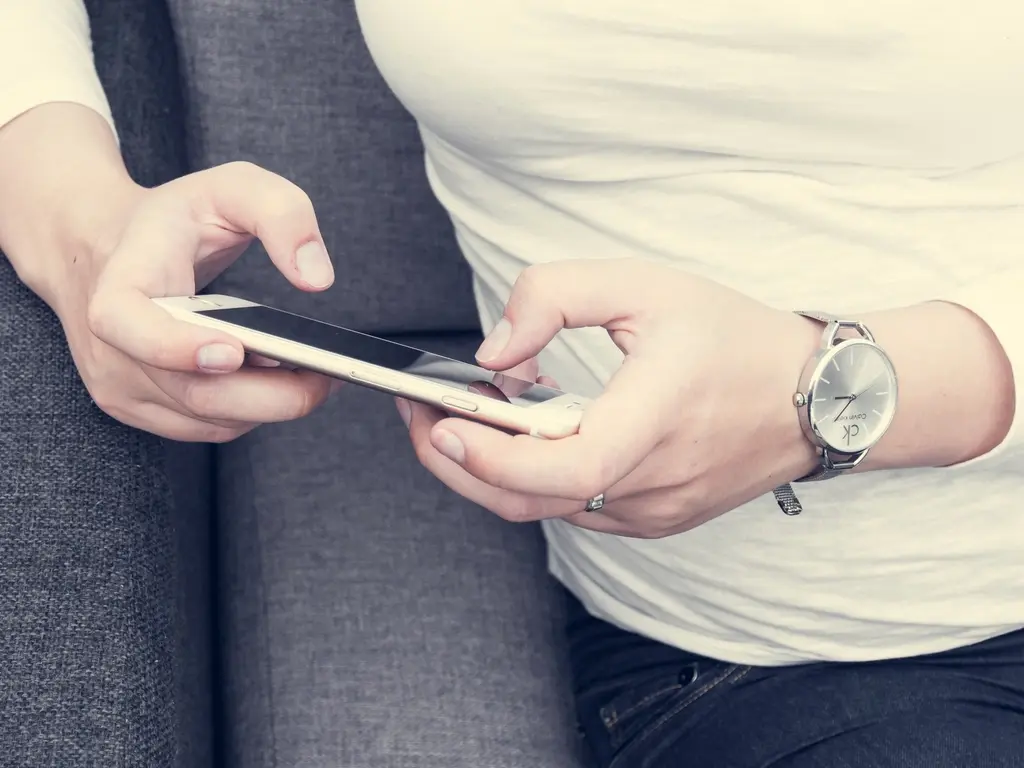 Person using a smartphone app for digital contact sharing