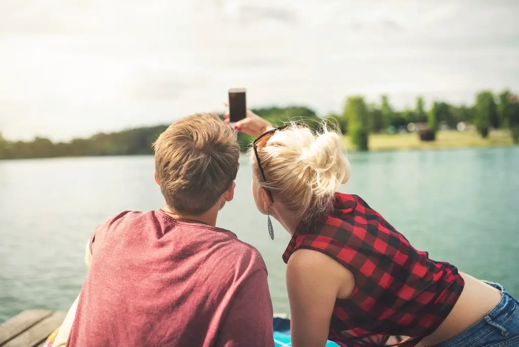 Two people taking a selfie together outdoors