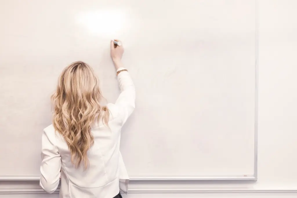 Business professional reviewing marketing charts and graphs at a desk