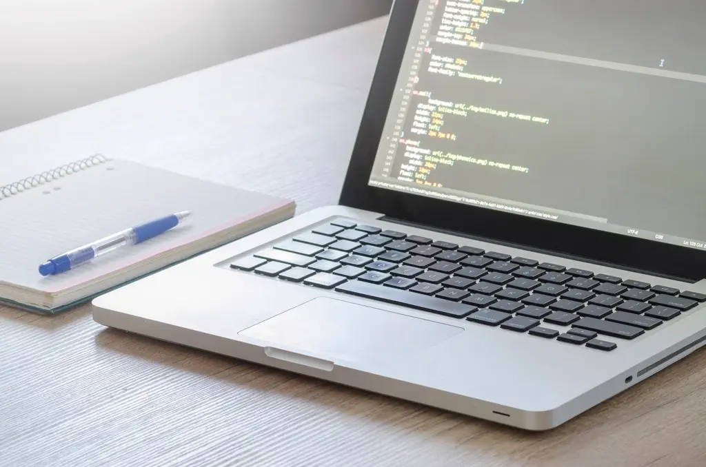 Laptop screen showing CSS code during a web design and development project