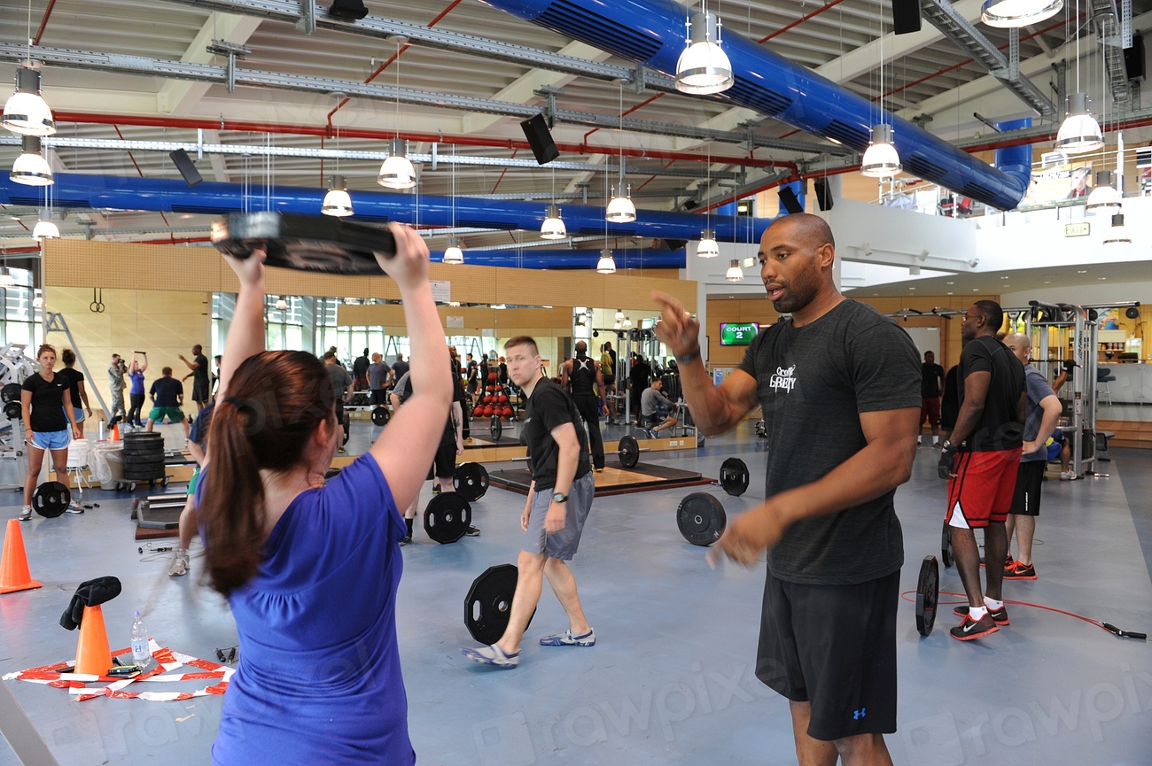 Person training with kettlebells in a gym, representing gym and fitness studio branding in Dubai