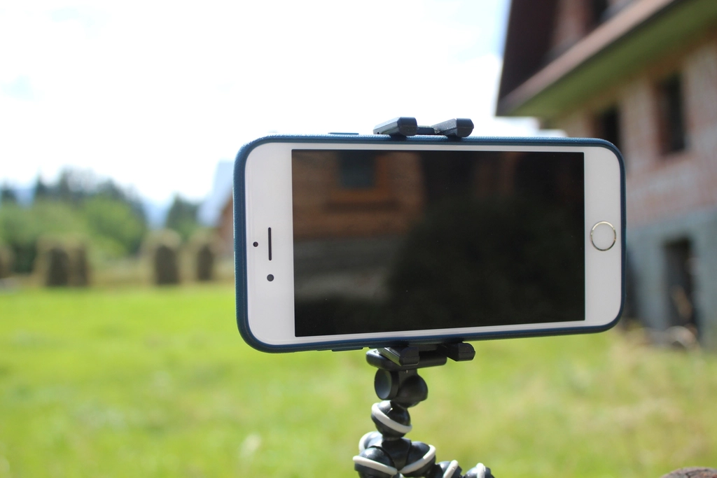 Smartphone mounted on a tripod recording video, representing short-form video content production in Dubai